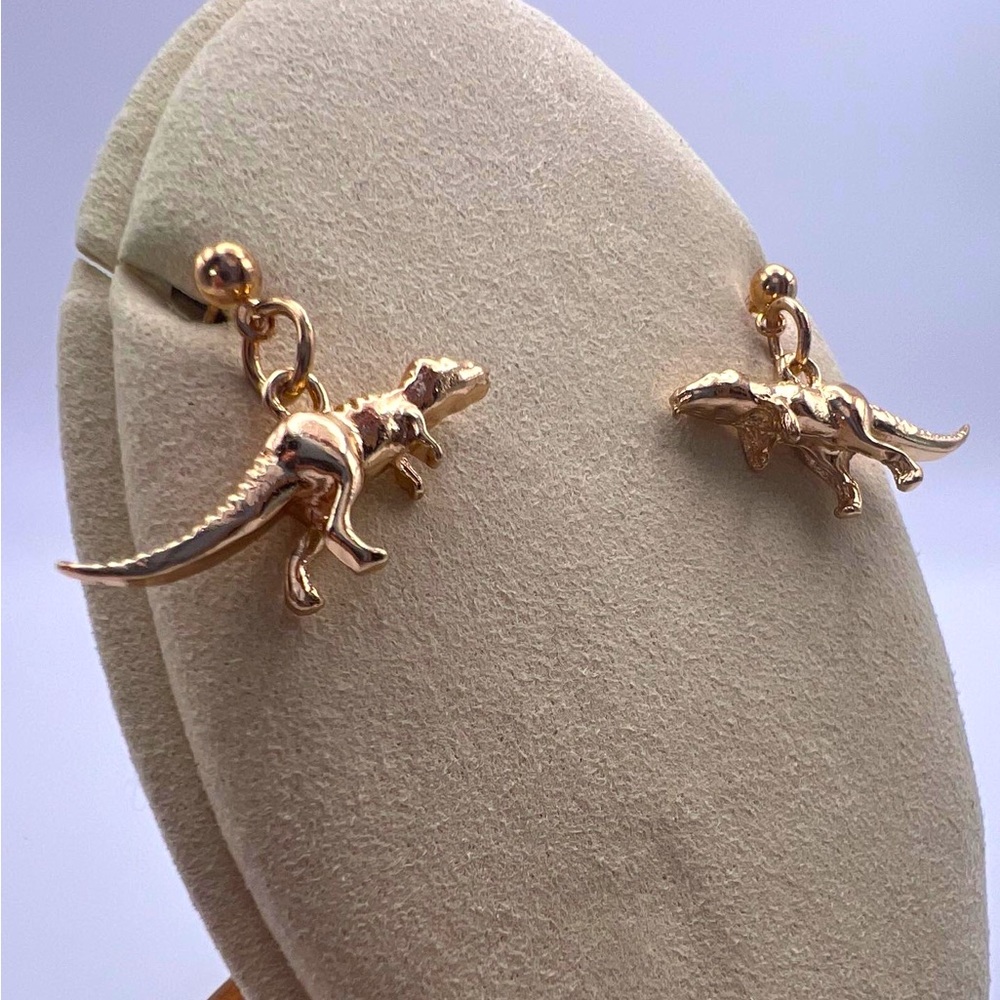 Gold t-Rex earrings
